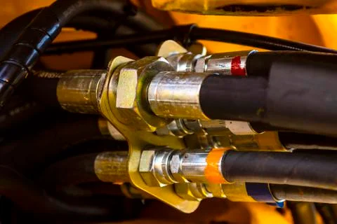 Close up of pipe system of hydraulic valves in agricultural machinery Stock Photos