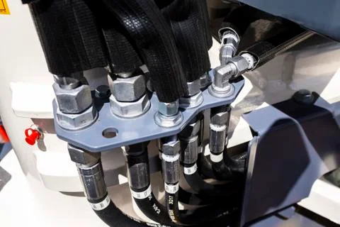Close up of pipe system of hydraulic valves in agricultural machinery Stock Photos