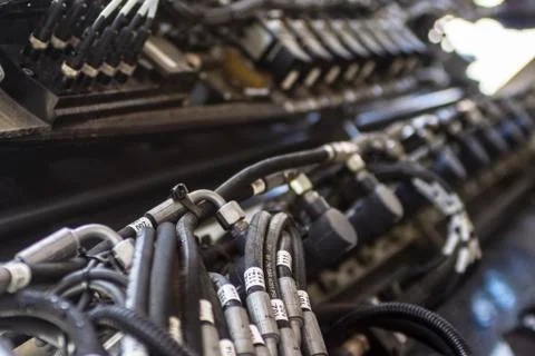 Close up of pipe system of hydraulic valves in agricultural machinery Stock Photos