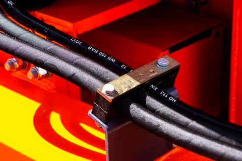 Close up of pipe system of hydraulic valves in agricultural machinery Stock Photos