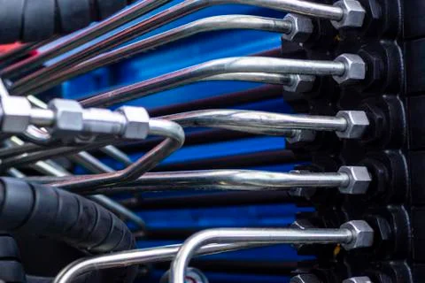 Close up of pipe system of hydraulic valves in agricultural machinery Stock Photos