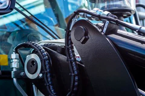 Close up of pipe system of hydraulic valves in agricultural machinery Stock Photos