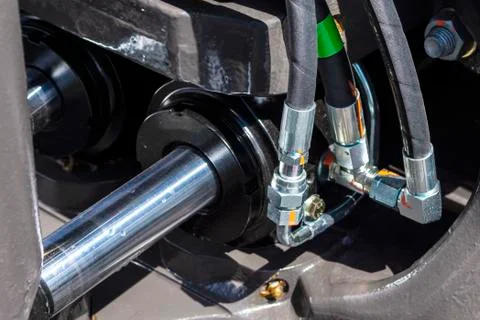 Close up of pipe system of hydraulic valves in agricultural machinery Stock Photos
