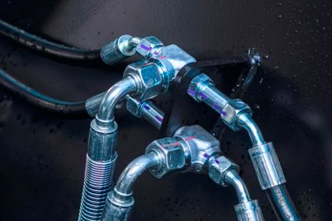 Close up of pipe system of hydraulic valves in agricultural machinery Stock Photos