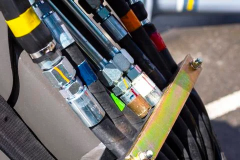 Close up of pipe system of hydraulic valves in agricultural machinery Stock Photos