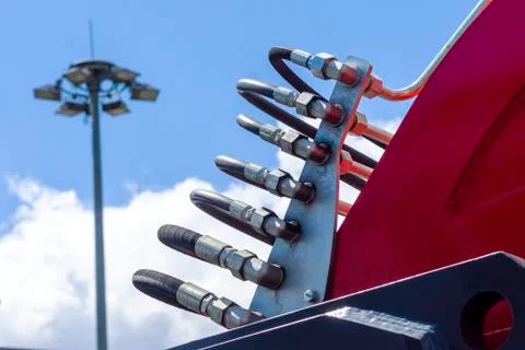 Close up of pipe system of hydraulic valves in agricultural machinery Stock Photos