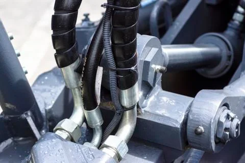 Close up of pipe system of hydraulic valves in agricultural machinery Stock Photos