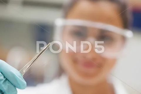 Close up of pipette hold by student Stock Photos
