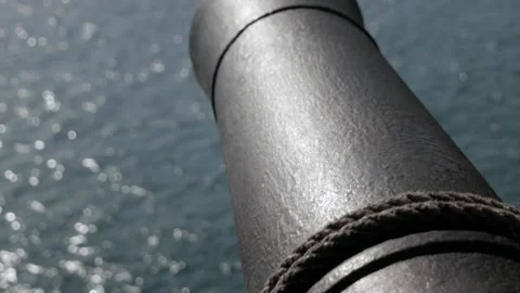 Close up pirate cannon under the deck of an 18th century sailing ship with the Stock Footage 281769490
