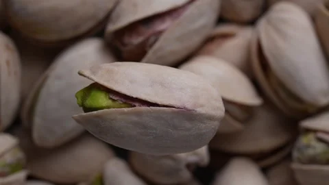 Close up pistachio nuts in shell, rotates Video stock 345815289