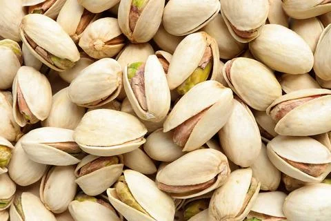 Close up of Pistachios nuts  as a background. raw unsalted pistachios nuts.  Stock Photos