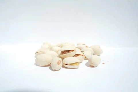 Close up of pistachios on white background Stock Photos