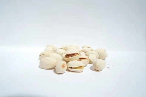Close up of pistachios on white background Stock Photos