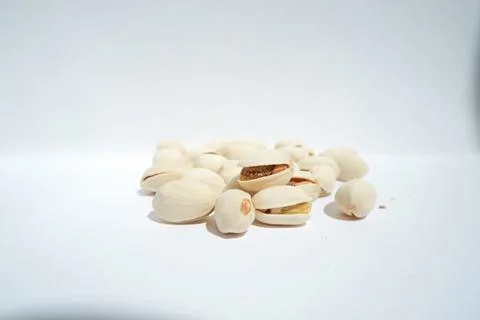 Close up of pistachios on white background Stock Photos