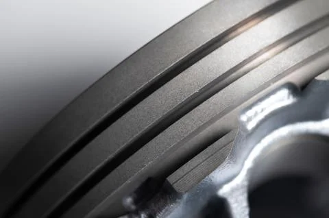 Close-up piston of an internal combustion engine on a gray background. New spare Stock Photos