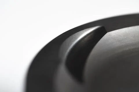 Close-up piston of an internal combustion engine on a gray background. New spare Stock Photos