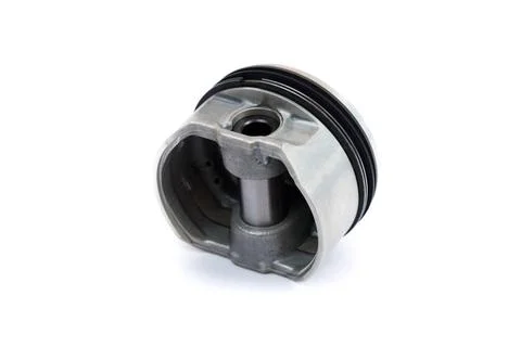 A close-up piston of an internal combustion engine with piston rings isola... Stock Photos