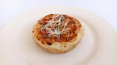 Close up pizza bread with condiment on plate isolated Stock Photos