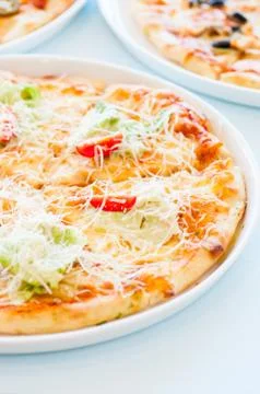 Close up of pizza caesar on a plate. Stock Photos