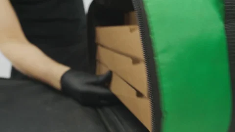 Close-up of pizza in delivery bag Stock Footage 129876661