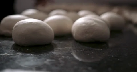 Close up of pizza dough balls in the back of an industrial kitchen Stock Footage 104963928