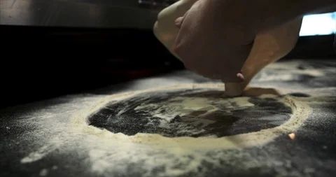 Close up of pizza dough being expertly tossed Stock Footage 104967368