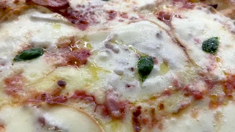 Close up on pizza with melted cheese Stock Footage 311956823