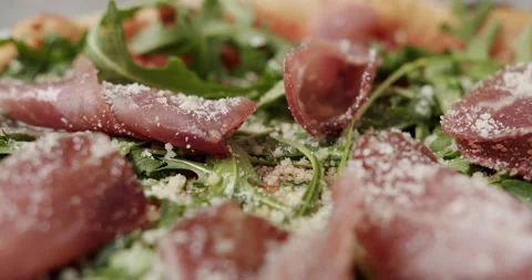 Close Up Pizza with prosciutto parma ham, arugula salad rocket with ingredients Vídeos de archivo 171238866