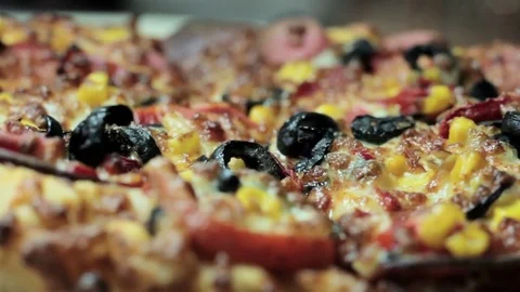 Close up pizza rotating on table, from above, top view Stock Footage 75615833