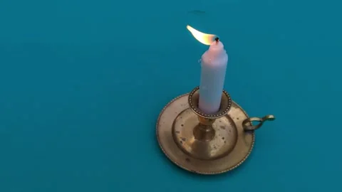 Close up of placing a burning candle shooting on a green screen Vídeos de archivo 342845521