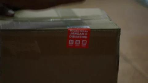 Close up of placing a large box or package Stock Footage 327788694