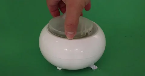 Close-up of placing the plastic caps on a white aroma oil diffuser humidifier Stock Footage 201268401