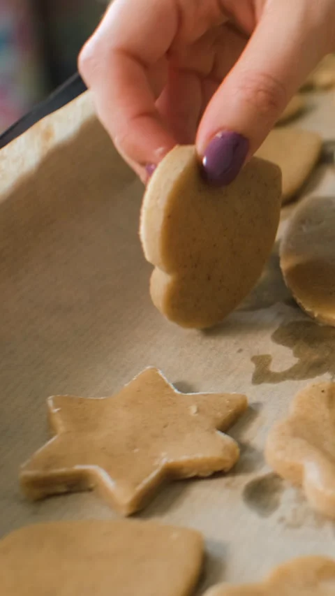 Close-up of placing raw cookies on baking tray Stock Footage 322219256