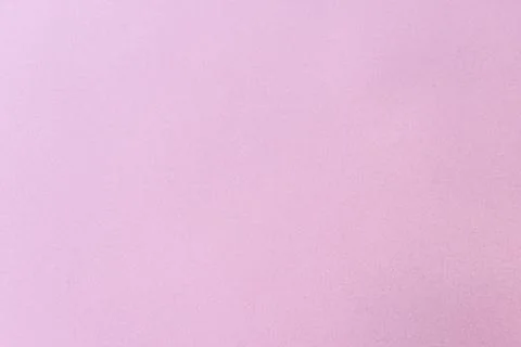A close-up of a plain purple paper surface with a subtle texture. Stock Photos