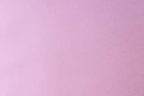 A close-up of a plain purple paper surface with a subtle texture. Stock Photos