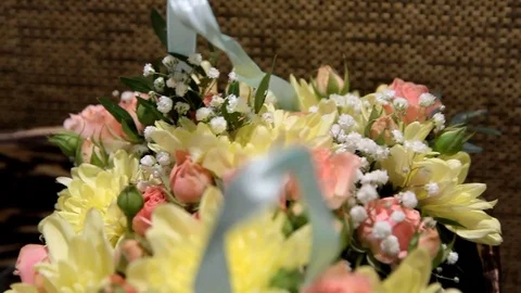 Close plan of a bright bouquet of yellow and pink flowers Stock Footage 123624027