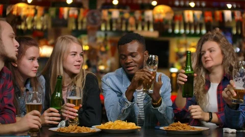 Close-up plan a company of friends makes a toast and everybody knocks, check 스톡 동영상 114653676
