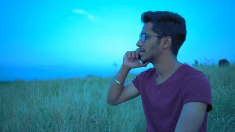 Close-up Plan, Indian Man Conducting a Conversation on a Phone on the Background Stock Footage 92041614