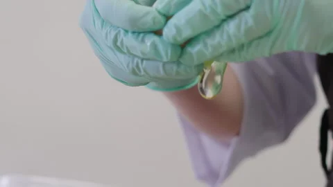 Close Plan, Slow Motion, Chef's Hands in Gloves Break Chicken Egg Stock Footage 136779673