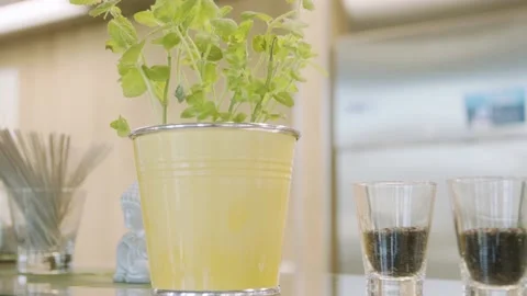 Close up plan in a yellow bucket behind the buckte a little budda Stock Footage 203897385