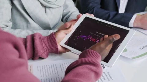 Close up of planning work on paper and document with team member and graphs t Stock Footage 256743198