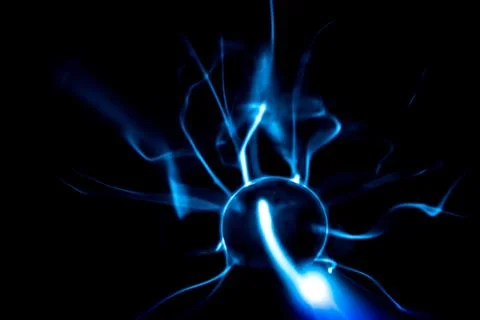 Close-up of a plasma ball globe glowing with blue and purple light and ener.. Stock Photos
