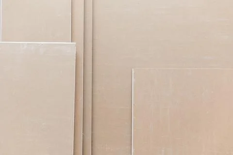 Close up of plasterboard, a type of drywall made of plaster between two sheets Stock Photos