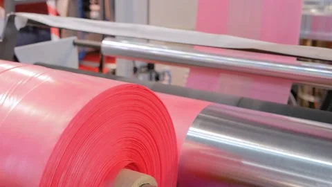 Close up: plastic bag making machine - moving roller at recycling exhibition Vidéo 150801071