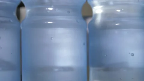 Close up of a plastic bottle filled with carbonated mineral water. Video stock 195732398
