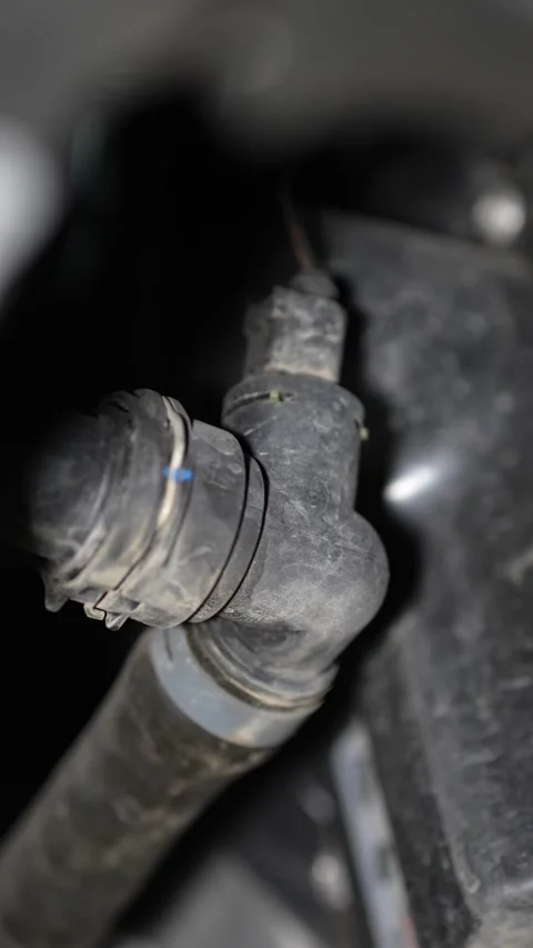 Close-up of a plastic coolant hose quick connector with sensor. Stock Footage 345707574