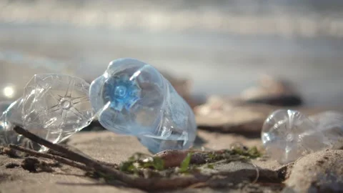 Close up of plastic pollution on the beach. Plastic pollution and environmental Видео 254591991