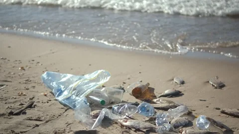 Close up of plastic pollution on the beach. Plastic pollution and environmental Vídeo Stock 254878864