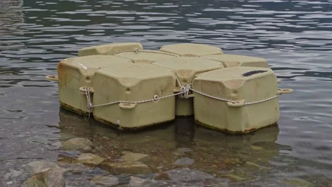 Close-up of plastic pontoons floating in the sea. Pontoons for quick assembly of Stock Footage 218953700