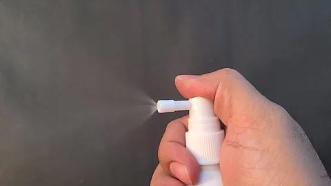 Close Up Of A Plastic Spray Bottle Pouring Liquid. Slow Motion Footage Stock Footage 265486178